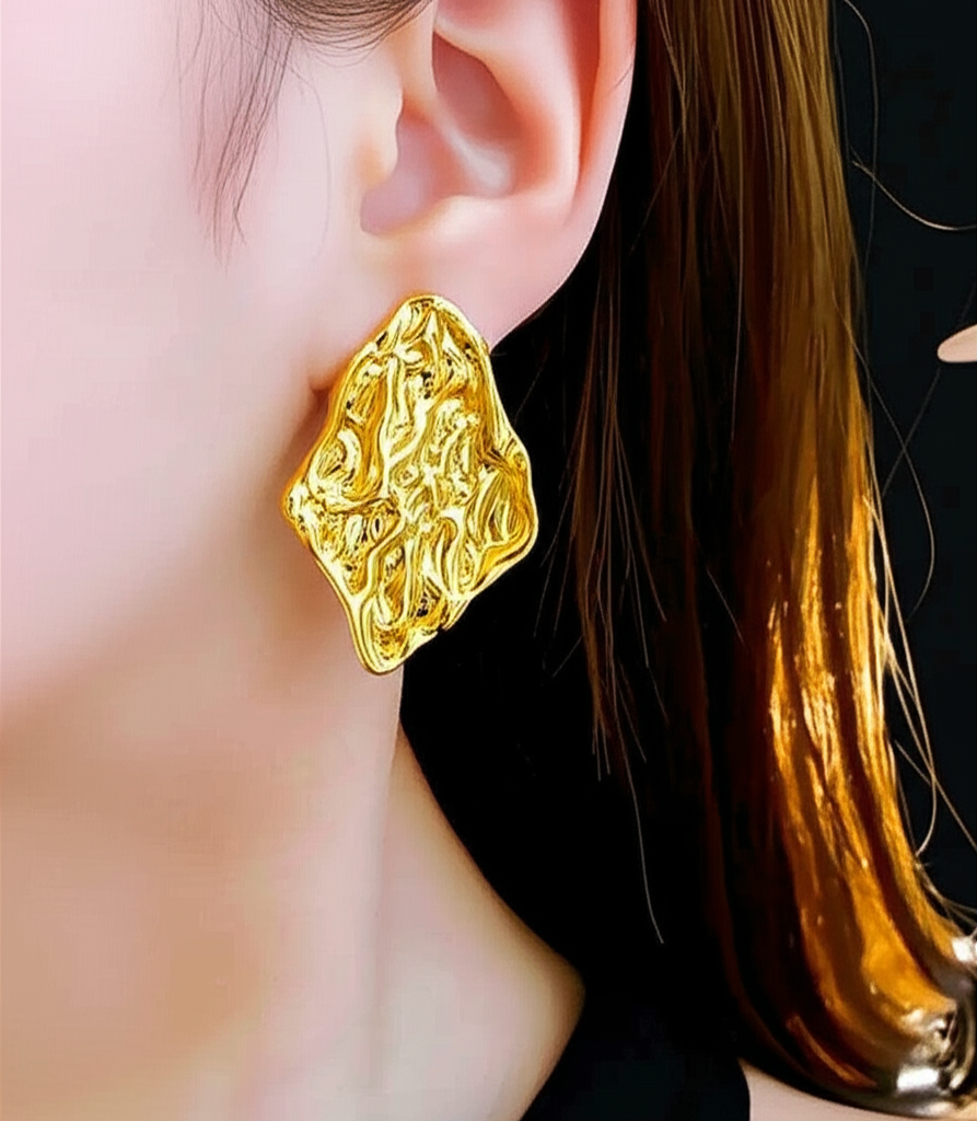 Gold ripple earring